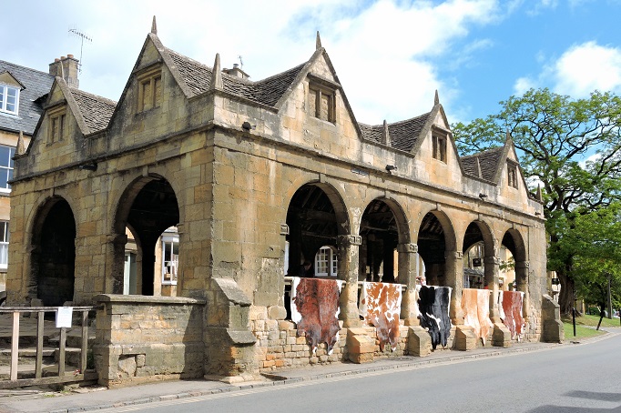 old stone building with cow hides for sale