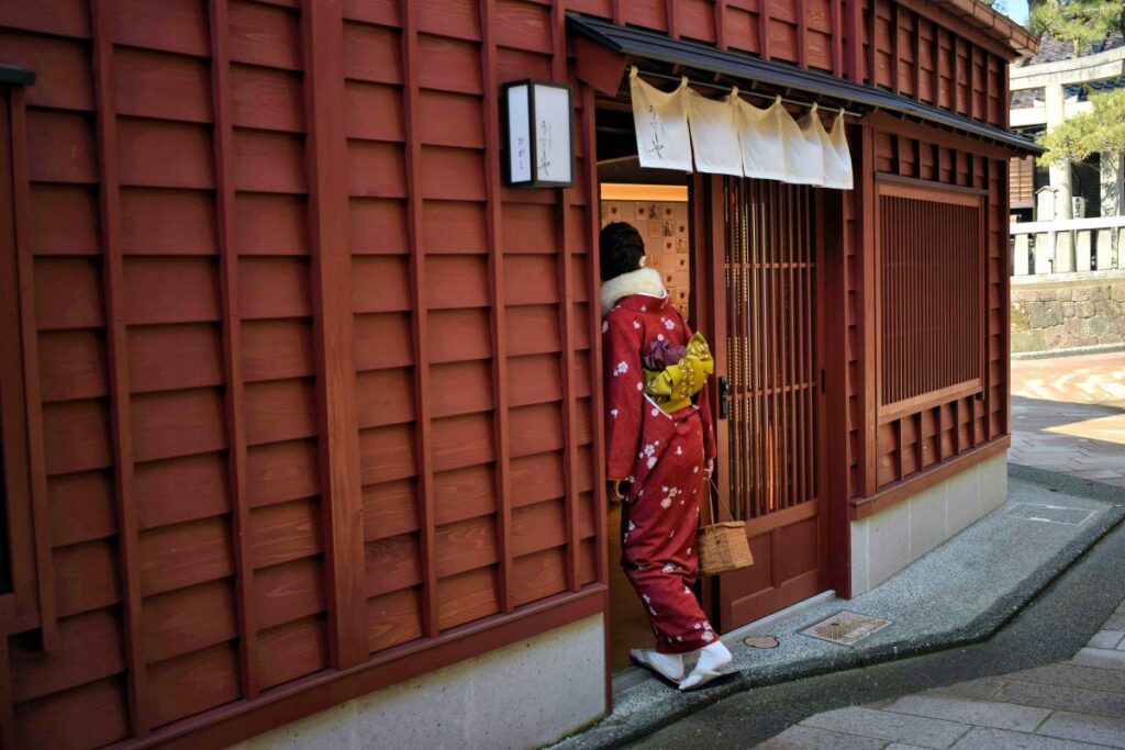 lady entering shop in tea house district