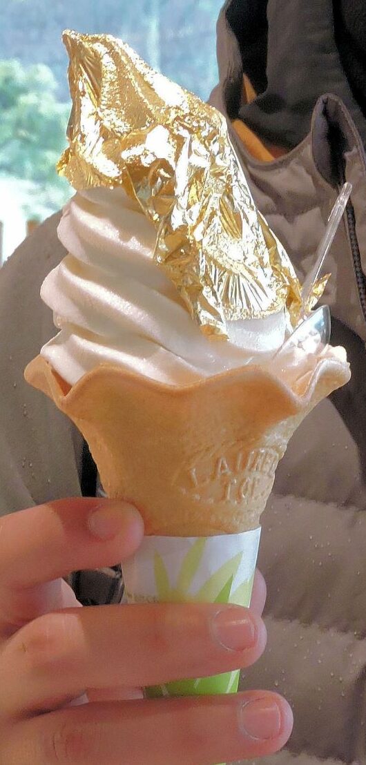 gold foil leaf on top of vanilla soft serve ice cream
